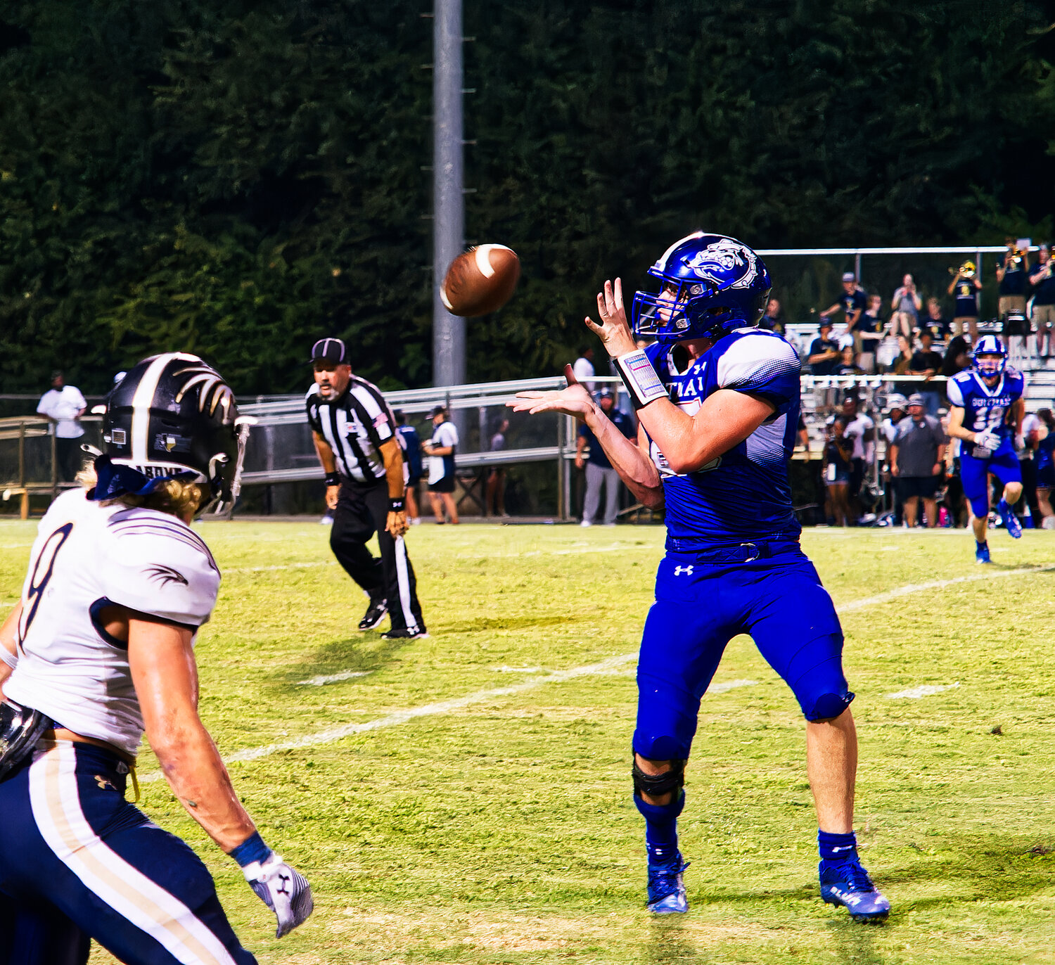 Jace Peek receives a pass. [more images from the Bulldogs' home-opener]